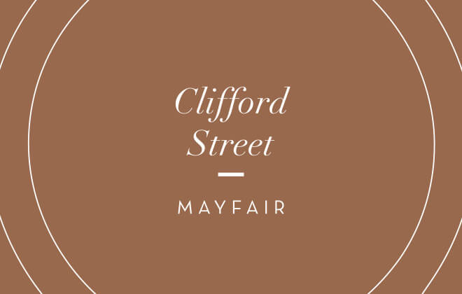 White 9 Clifford Street logo printed on a dark gold brochure cover