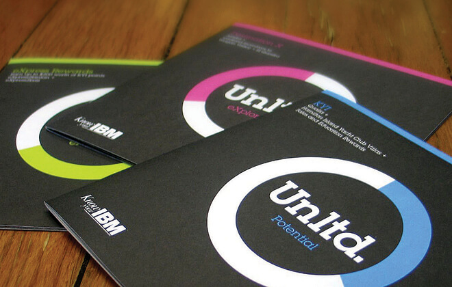 Front covers and an inside spread of the branded IBM Unltd printed collateral